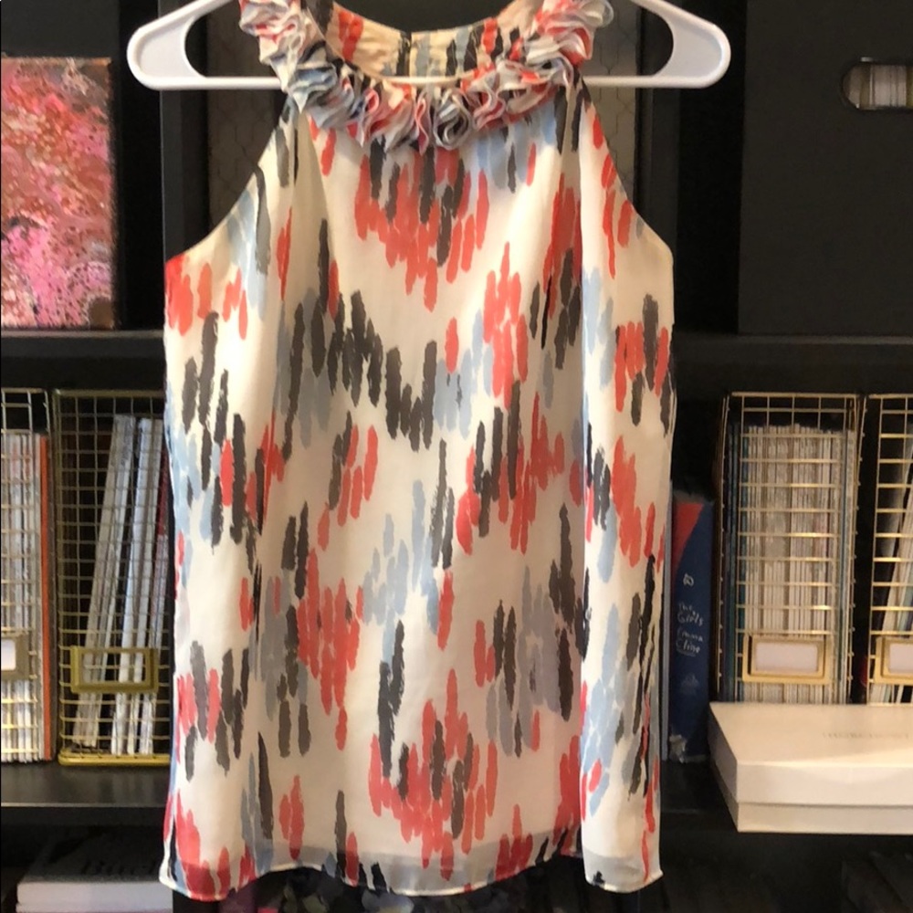 Sleeveless blouse w/ beautiful ruffled neckline